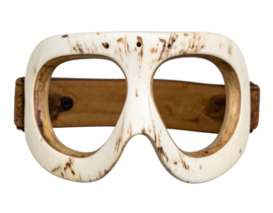 Inuit snow goggles carved from bone, isolated on a transparent background