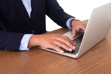 businessman typing on laptop