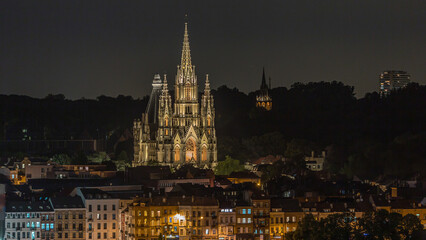 Fototapeta premium Aerial view of Notre Dame de Laeken church spires night timelapse in Brussels, Belgium.