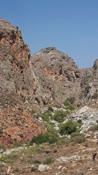 Arid and rocky landscape of the Zakros Gorge in Crete on a hot sunny summer day.
