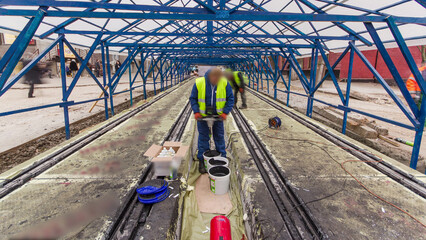 Tram rails at the stage of their installation and integration into concrete plates on the road timelapse.