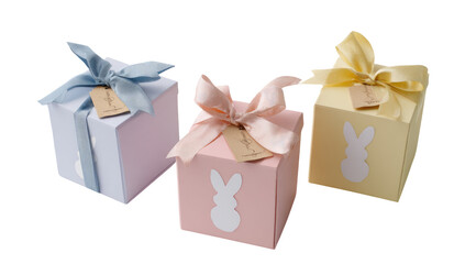 Obraz premium Three pastel-colored gift boxes, adorned with ribbons and rabbit silhouettes