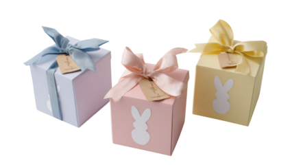 Three pastel-colored gift boxes, adorned with ribbons and rabbit silhouettes