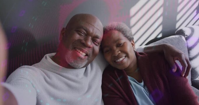 Couple making social media clip smiling into phone then adjusting angle with animated circles