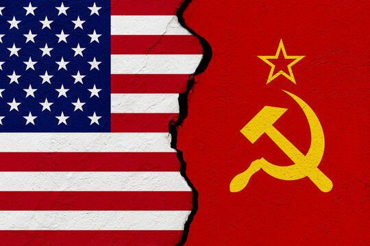 The flags of the United States of America and Union of Soviet Socialist Republics URSS into a grunge cracked wall