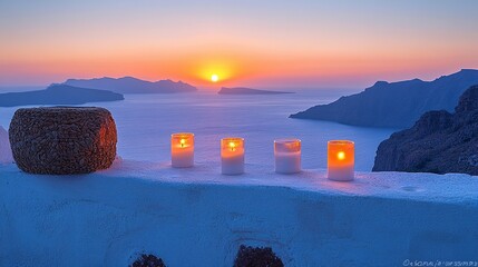 Sunset over the sea with candles on a white wall.