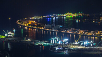 Fototapeta premium Aerial view of Palm Jumeirah Island night timelapse.