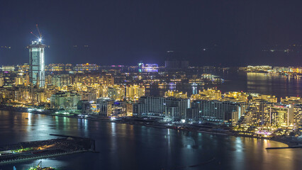 Fototapeta premium Aerial view of Palm Jumeirah Island night timelapse.