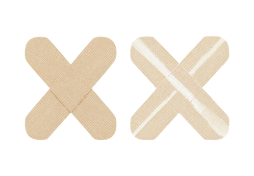 Two light beige adhesive bandages, shaped as X's, on a black background