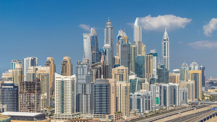 Naklejka premium Dubai Marina skyscrapers aerial top view with clouds from JLT in Dubai timelapse, UAE.