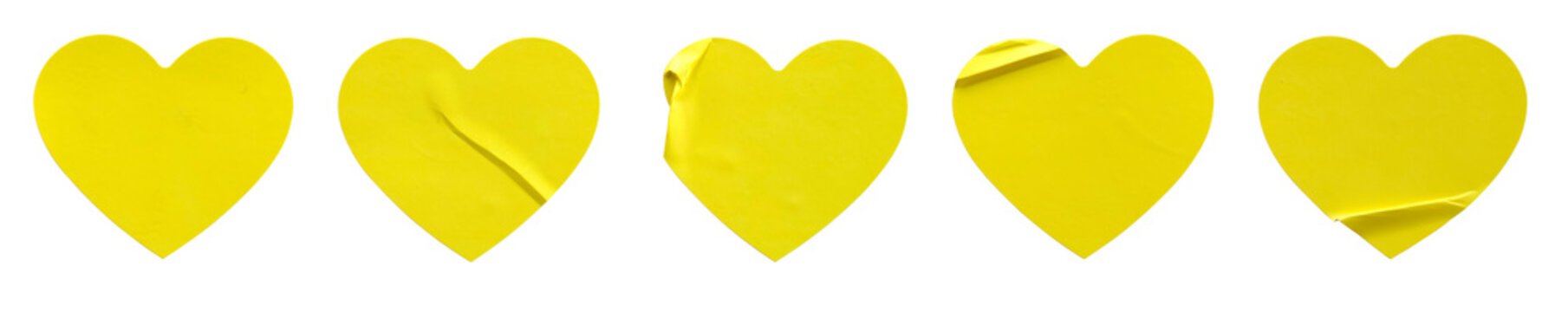 A set of yellow love or heart shape paper sticker label isolated on white background.