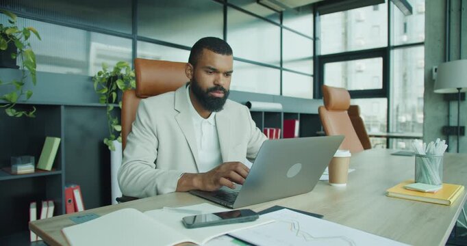 Dedicated and Focused Professional Working Effectively in a Modern Office Environment