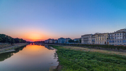 Fototapeta premium Sunset skyline view of Florence City, housing, buildings and Arno River. Colorful sky in Italy
