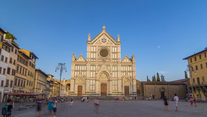 Fototapeta premium Tourists on Piazza di Santa Croce timelapse hyperlapse with Basilica di Santa Croce Basilica of the Holy Cross in Florence city.
