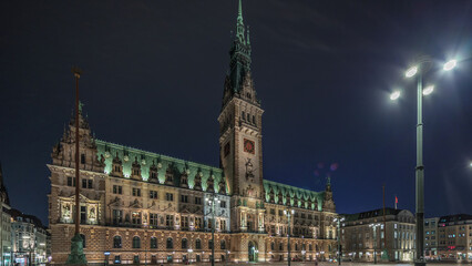 Panorama showing a building of the Hamburg City Hall night timelapse, the seat of the government of...