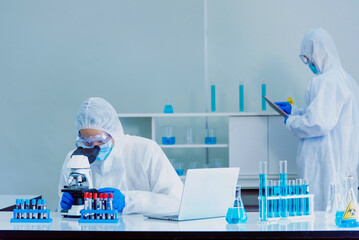 Two asian scientist team reserch chemistry science tube experiment biotech antibody sample in...