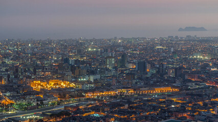 Aerial view of Lima skyline day to night timelapse from San Cristobal hill.