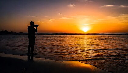 Fototapeta premium Silhouette of a loving couple on the beach at sunset with waves and orange sky