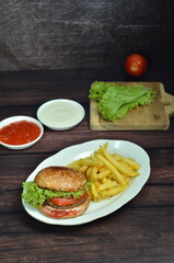 Beef burger with French fries, fresh made and tasty