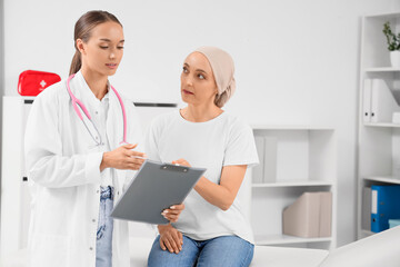 Mature woman after chemotherapy visiting doctor in clinic