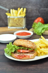 Beef burger with French fries, fresh made and tasty