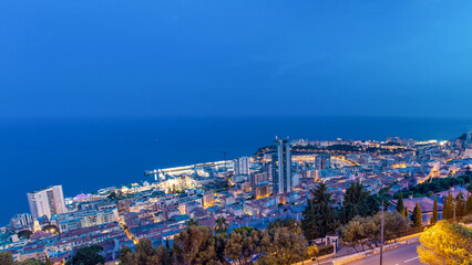 Cityscape of Monte Carlo, Monaco day to night timelapse with roofs of buildings after summer sunset.