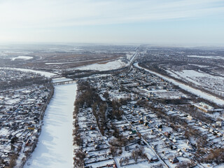 Snowy aerial panorama of Uralsk city in Kazakhstan with residential and industrial zones. c.