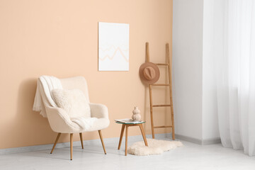 Interior of light room with white armchair, table and stepladder near window