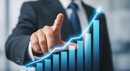 Businessman pointing at upward trending graph suit