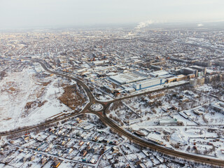 Snowy aerial panorama of Uralsk city in Kazakhstan with residential and industrial zones. c.