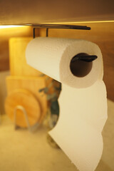 Close view of paper towel roll on kitchen holder