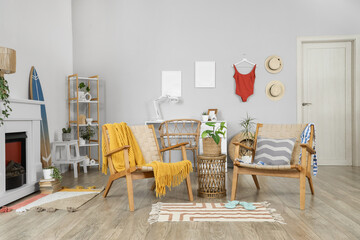 Interior of living room with swimsuits, armchairs and plants