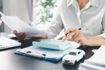 Sale agent deal to agreement successful car loan contract with customer and sign agreement contract...
