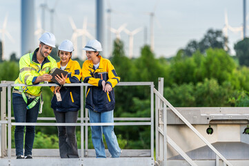 Team of Engineers Planning Project for Renewable Energy Professional Team Inspecting Wind Turbines...