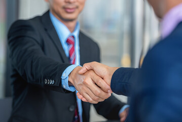 Two businessmen shaking hands