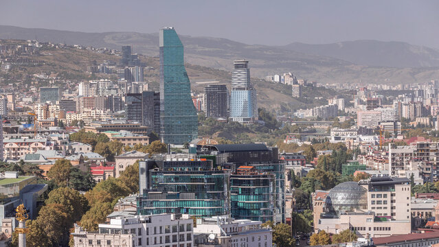 Glass towers of hotels and offices in Tbilisi aerial timelapse, skyscrapers of Georgia