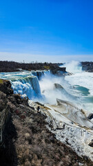 Half frozen niagara falls in upstate New York, USA.