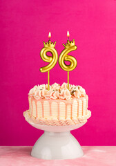 Number 96 birthday candle - Pink celebration cake with drip icing