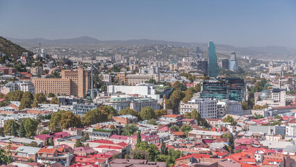 Cityscape panorama with glass tower of hotel in Tbilisi aerial timelapse, skyscrapers of Georgia