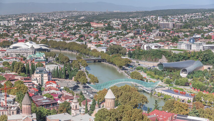Aerial timelapse of the Bridge of Peace, a bow-shaped pedestrian bridge in Tbilisi, Georgia © HyperlapsePro