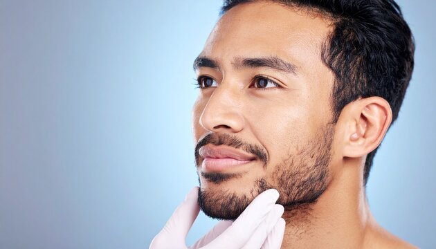 Close-up of a man's face being examined by a gloved hand, possibly for cosmetic or medical purposes. - Powered by Adobe