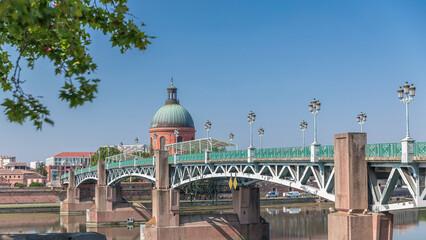 Naklejka premium Saint Pierre Bridge over the Garonne River timelapse hyperlapse and La Grave Hospital. Toulouse, France