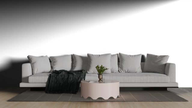 a couch with pillows and a blanket on a rug
