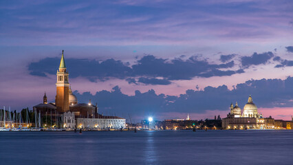 Fototapeta premium Boats on Grand Canal and Basilica Santa Maria della Salute day to night timelapse, Venice, Italy