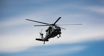 Fototapeta premium helicopter flying in the sky