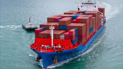 Aerial of cargo ship carrying container  for export cargo from cargo yard port to other ocean...