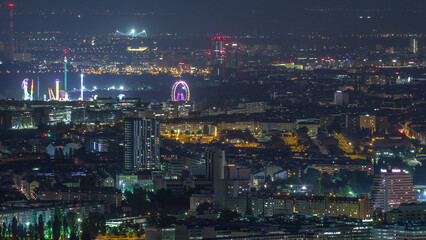 Fototapeta premium Skyline of Vienna from Danube Viewpoint Leopoldsberg aerial night timelapse.
