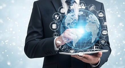 A businessman holding a tablet with a digital globe and various icons surrounding it in a suit