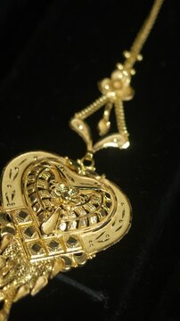 Closeup of designer head jewellery, 18k HUID certified gold jewellery, Vertical shot