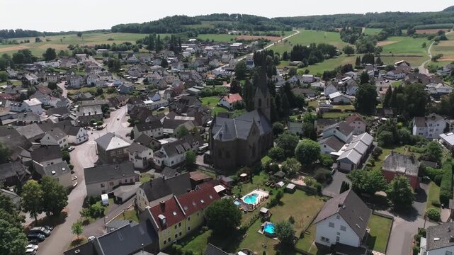 Reveal shot of the catholic parish church St. Stephanus in Thalheim